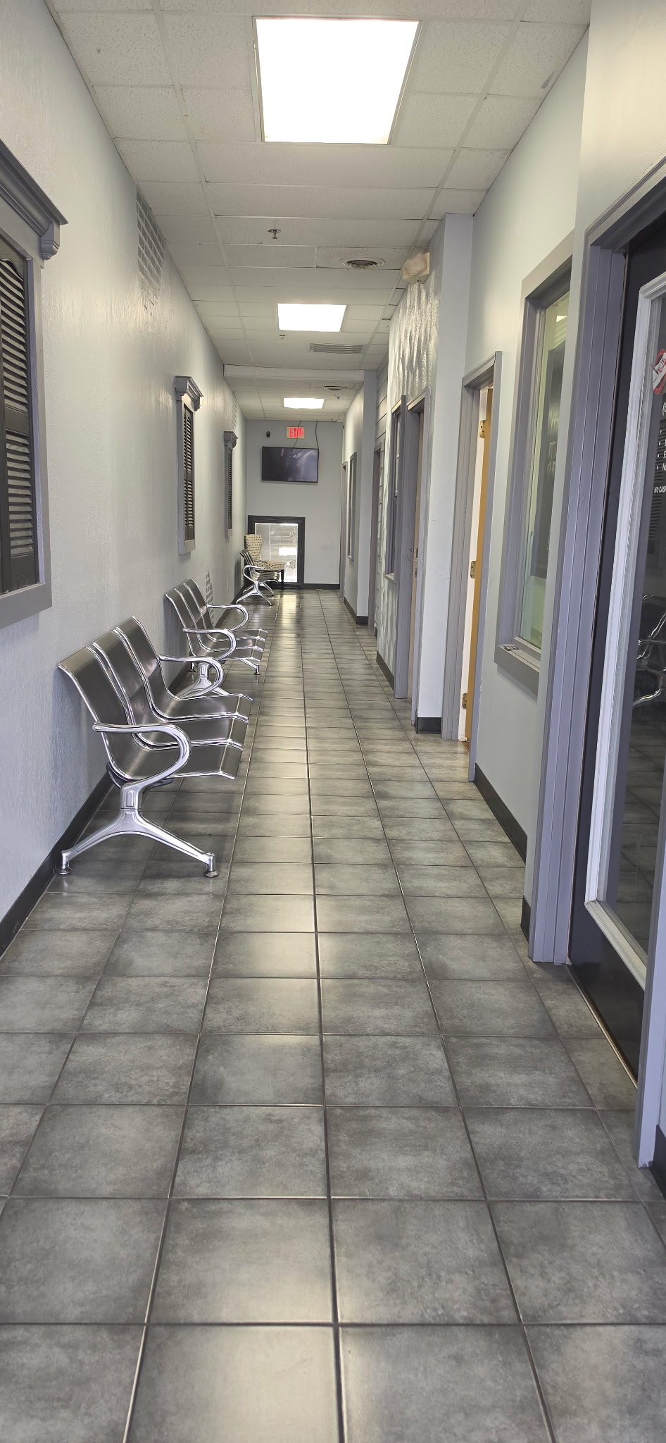 Clean shared hallway and waiting area at Pro Suites