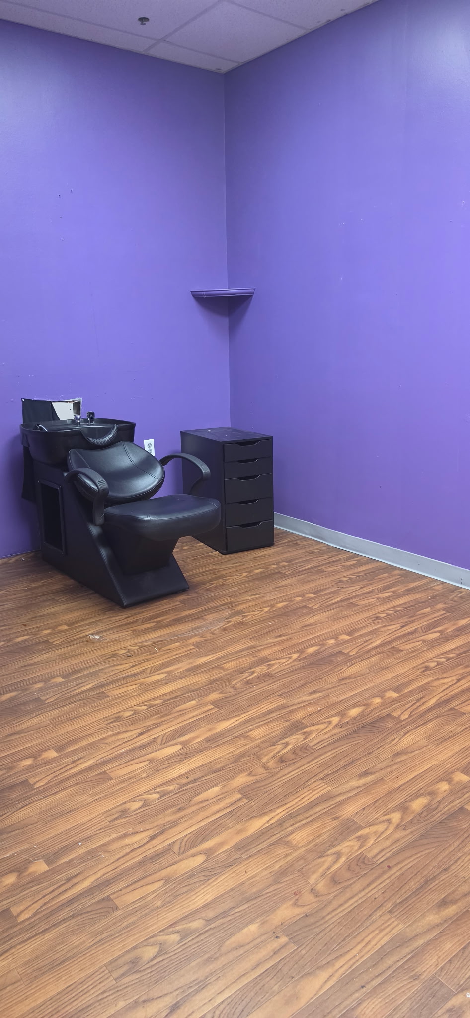 Private salon suite with shampoo station and open floor space